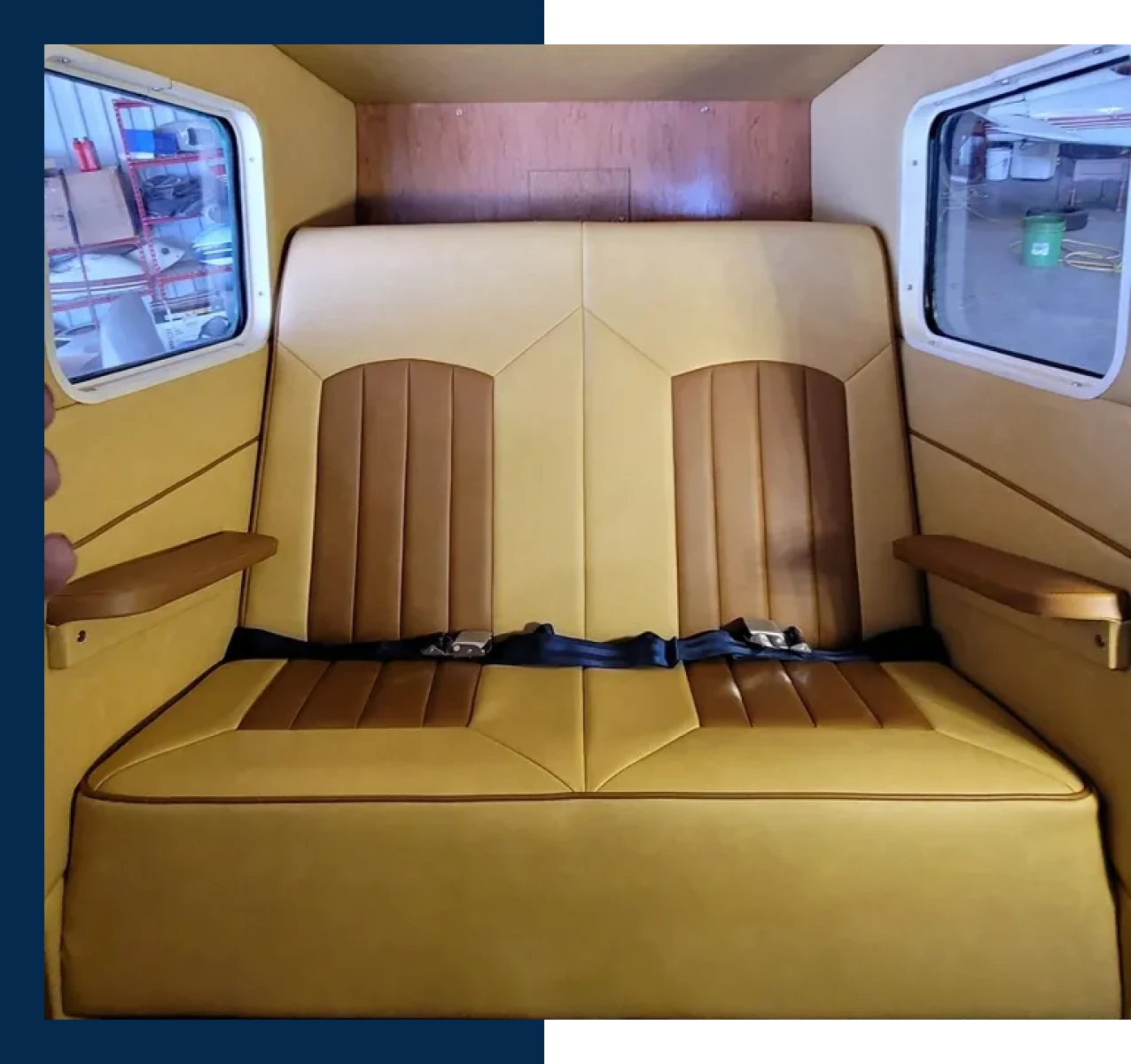 Twin airplane seats with brown accents